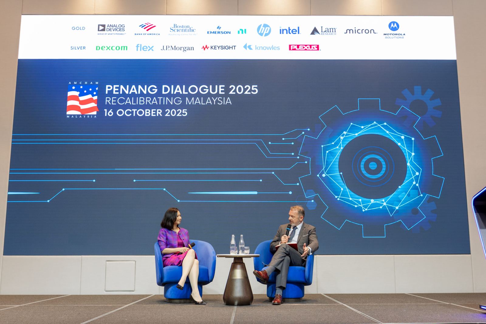 Two speakers in conversation at AMCHAM Penang Dialogue 2025