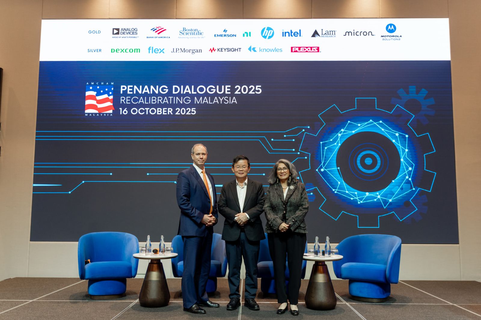 A speaker at the lectern at AMCHAM Penang Dialogue 2025